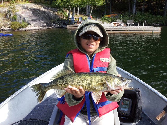 2012-09-01 09.54.19.jpg - Clear Lake in Arnstein is definitely the go to spot for Josh. He completes the trilogy with a 2.2lb Walleye ...Bass, pike, and now walleye on the same trip. Awesome job buddy !!
